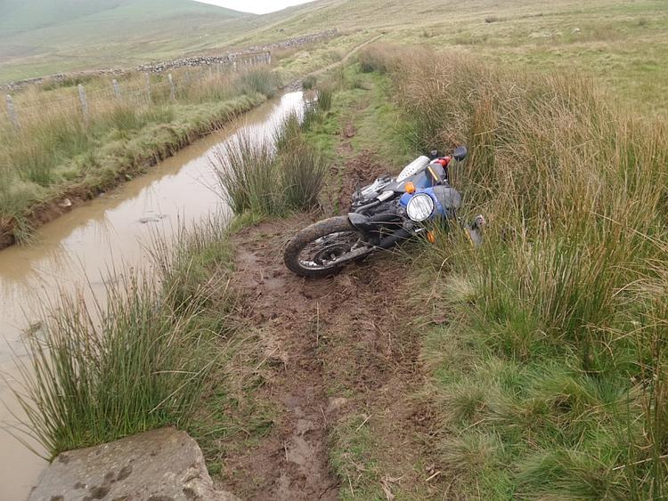The FX650 lying in the mud