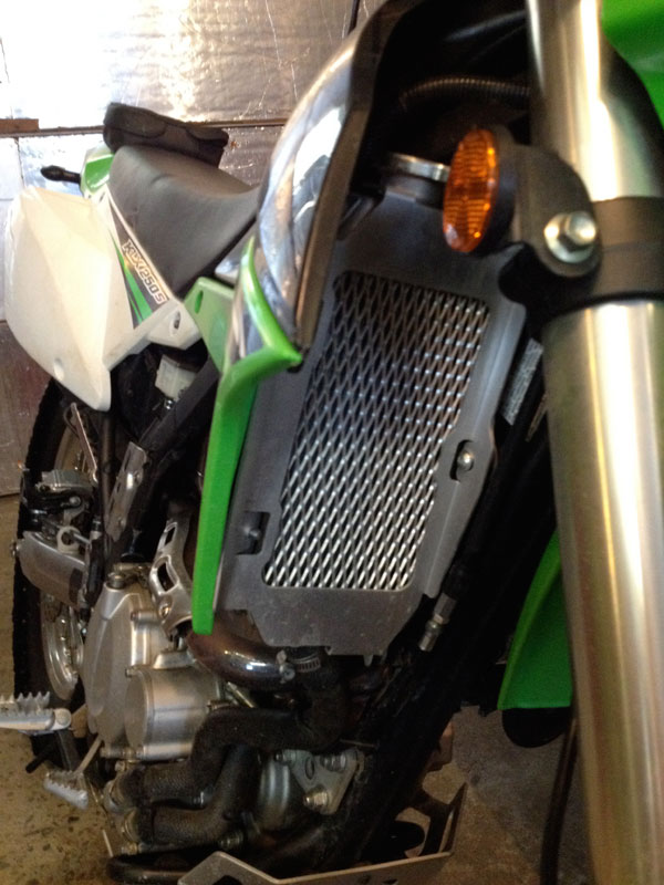 dual sport grips, Pro taper handlebar, and folding mirror.