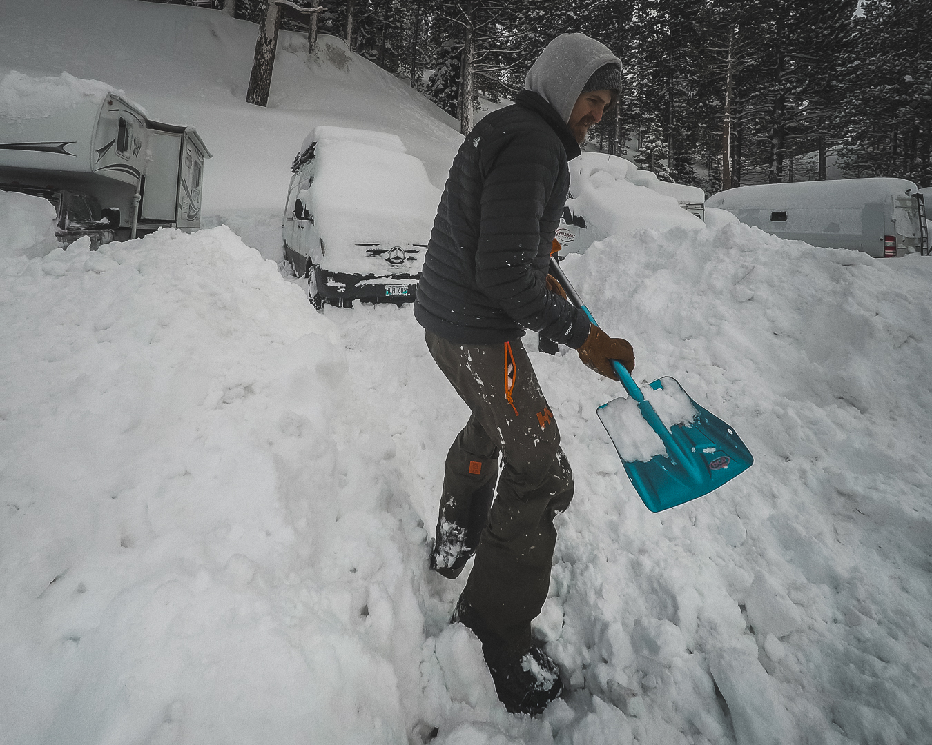 Shovelling the van out of the snow.