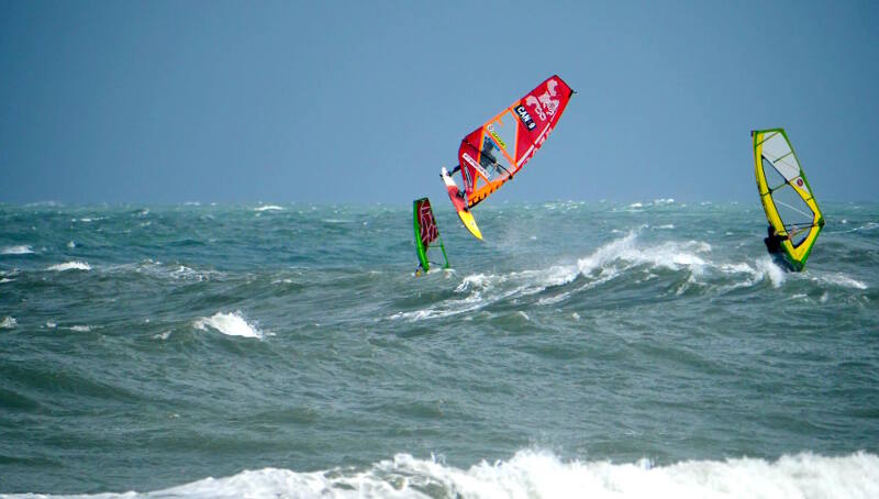Phi Soltysiak windsurfing looping at the Cape Hatteras Lighthouse. Photo by Nicholas Chapleau/