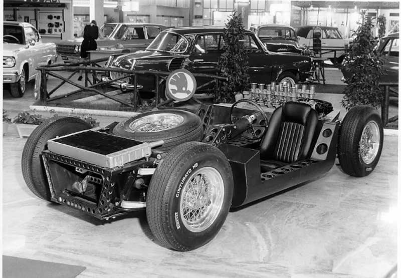 the Lamborghini TP400 prototype chassis at Turin Motor Show 1965 in front of the rare Lamborghini 350 GTS