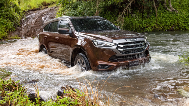 2021 Isuzu MU-X LS-U - front 3/4 dynamic shot, driving through water