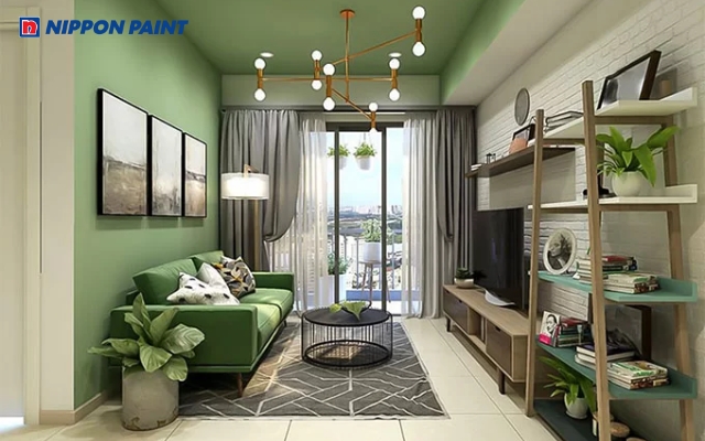 Phòng khách hiện đại với tông màu xanh lá, đen và điểm nhấn sắc cam tinh tế